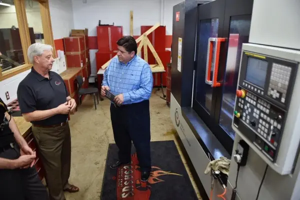 Jupiter Machine Tool CEO, Ray Whitehead with Illinois Governor JB Pritzker talking about reshoring American Manufacturing at Pegasus Manufacturing and bringing good jobs and training back to Illinois.